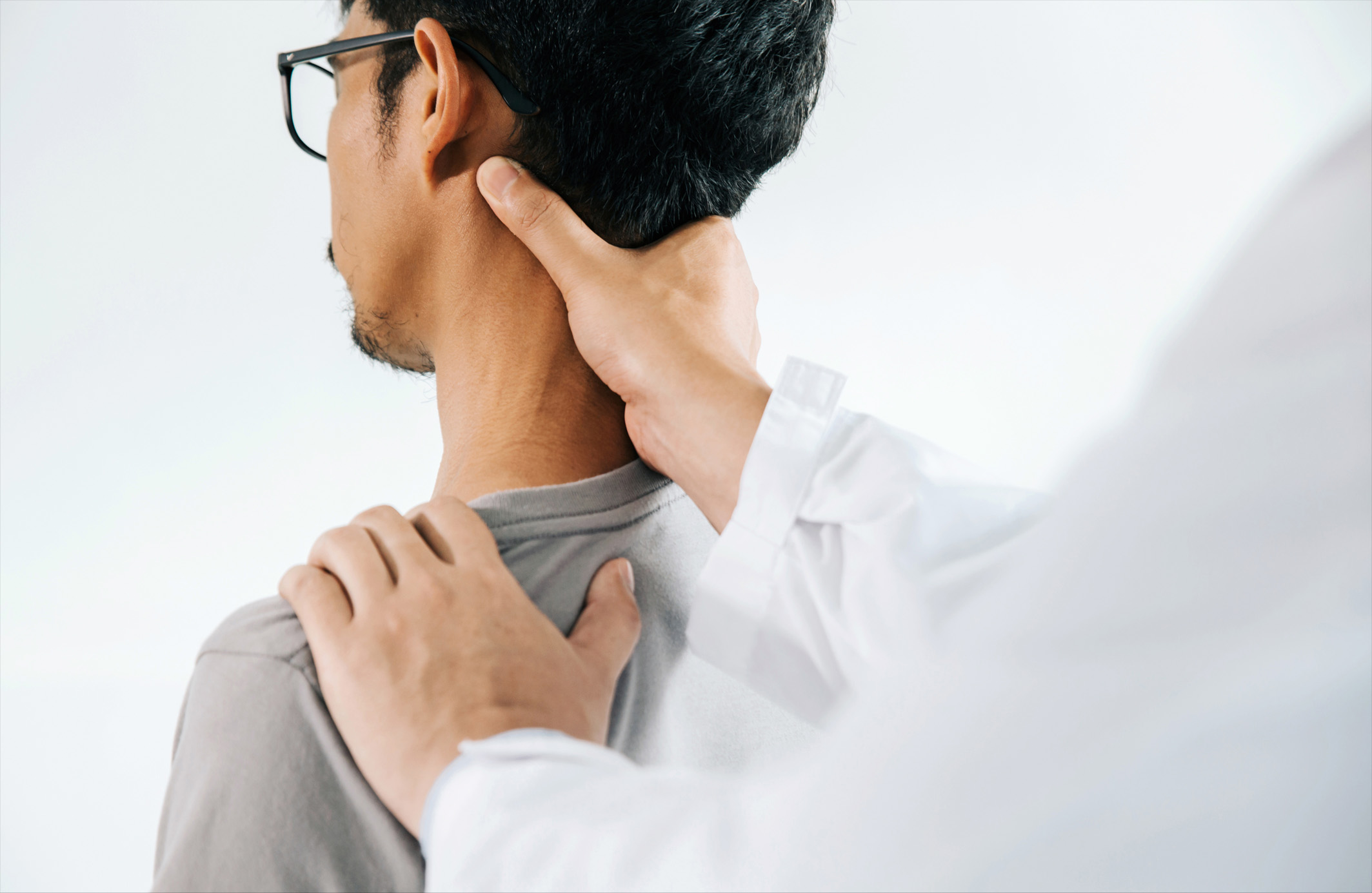 Chiropractor doing healing treatment on man's neck,Chiropract